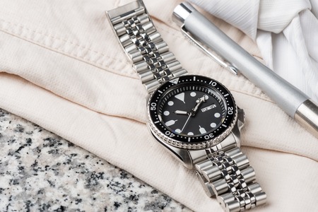 closeup men dive watch with stainless steel bracelet