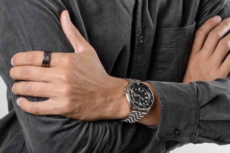 The man posing with dive watch with stainless steel braceletの写真素材