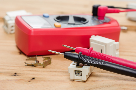 digital multimeter or multitester or Volt-Ohm meter (closeup at test leads), an electronic measuring instrument that combines several measurement functions in one unit.の写真素材