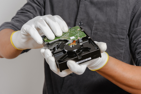 Electrician wear the antistatic gloves to protect an electrical components from damage.の写真素材