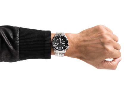 luxury watch on man's wrist over white backgroundの写真素材