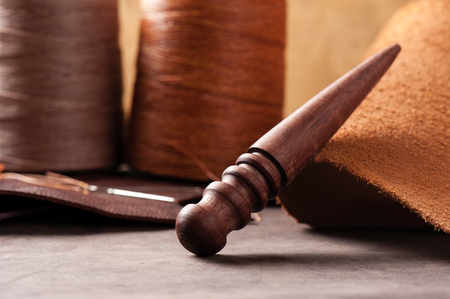 The wood slicker for hand stitching leather