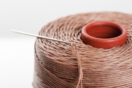 closeup brown waxed thread for hand stitching leatherの写真素材