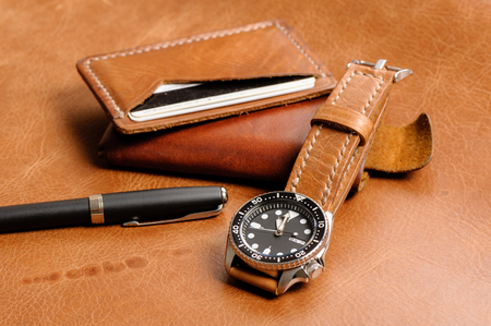 closeup luxury watch with handmade brown leather watch strapの写真素材
