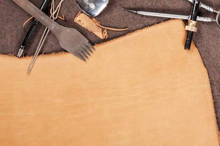 leather working background, blank tan nubuck leather in workshop