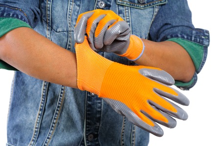 Closeup all purpose gloves with non-slip rubber coated on woker's hand.
