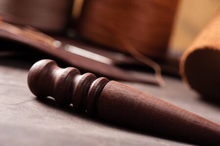 The wood slicker for hand stitching leatherの写真素材