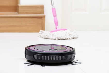 robotic vacuum cleaner on the floorの写真素材