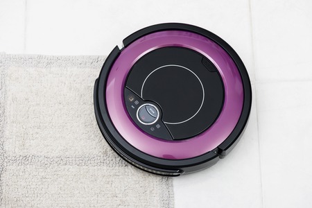 robotic vacuum cleaner on the floorの写真素材