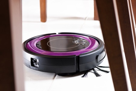robotic vacuum cleaner on the floorの写真素材