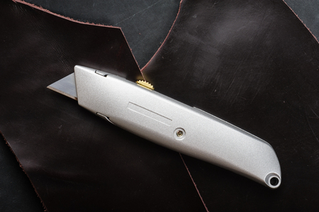 the retractable utility knife with Heavy-Duty Utility Blade