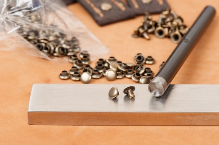 working with metal fittings, material for handicraft leather working and garment.の写真素材