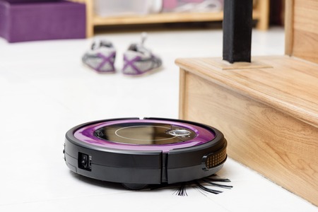 robotic vacuum cleaner on the floorの写真素材