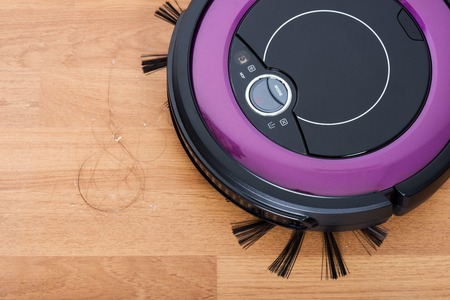 robotic vacuum cleaner cleaning the dirty floorの写真素材
