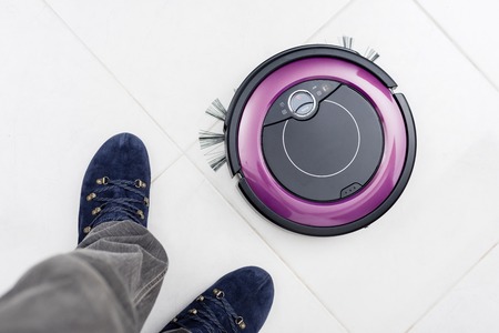 robotic vacuum cleaner on the floorの写真素材