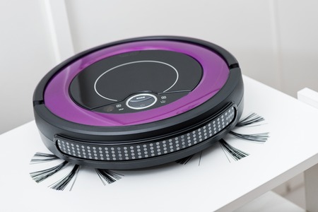 closeup robotic vacuum cleaner over white backgroundの写真素材