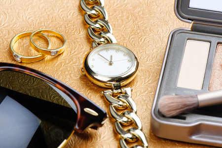 woman accessories, closeup shiny gold women wristwatchの写真素材