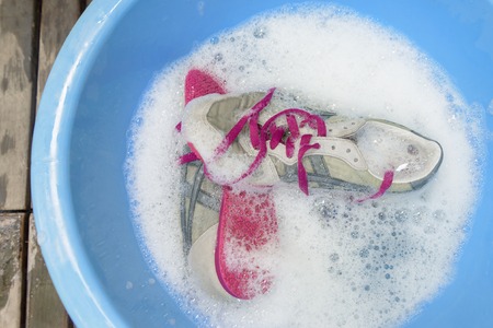 washing the dirty sneakers at home, cleaning the shoesの写真素材