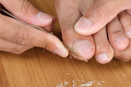foot manicure with nail clipper and file.の写真素材