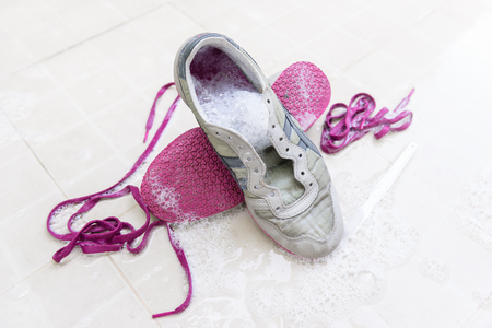 washing the dirty sneakers at home, cleaning the shoesの写真素材