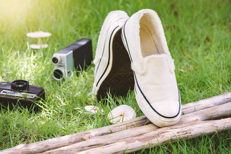 white women sneakers without laces in the gardenの写真素材