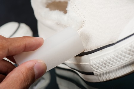 cleaning white canvas sneakers with canvas sneakers cleanerの写真素材