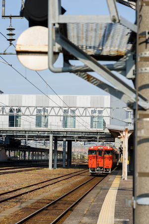 TAKAOKA, JAPAN - MAY 15, 2016: The local train JR Johana Line (shallow depth of field) at Takaoka Staion.のeditorial素材