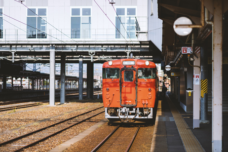 TAKAOKA, JAPAN - MAY 15, 2016: The local train JR Johana Line (shallow depth of field) at Takaoka Staion.のeditorial素材