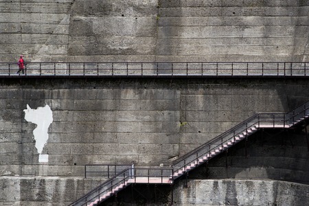 TOYAMA, JAPAN - MAY 17, 2016: An unidentified travelers at Kurobe Dam. The Kurobe Dam or Kuroyon Dam is a variable-radius arch dam on the Kurobe River in Toyama Prefecture, Japan.のeditorial素材