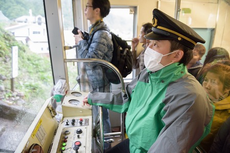 TOYAMA, JAPAN - MAY 17, 2016: An unidentified Japanese driver in Tateyama Cable car.