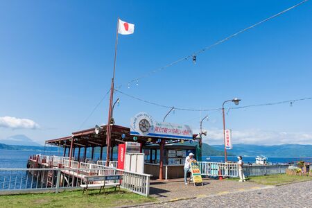 HOKKAIDO, JAPAN - JULY 20, 2015: The private dock with flag of Japan at Toya Lake (Toyako) in Hokkaido, Japan.のeditorial素材