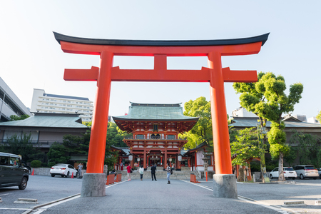 KOBE, JAPAN - MAY 18, 2016: Giant Japanese Gate or Torii at the entrance of Ikuta-Jinja shrine in Kobe. Ikuta Shrine is a Shinto shrine in the Chuo Ward of Kobe, Japan.のeditorial素材