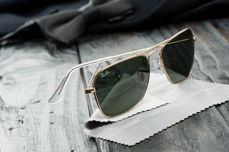 BANGKOK, THAILAND - AUGUST 24, 2016: The Ray-Ban Caravan with gold frame and classic G-15 Lens. Ray-Ban is a brand of sunglasses and eyeglasses founded in 1937 by American company Bausch & Lomb.のeditorial素材