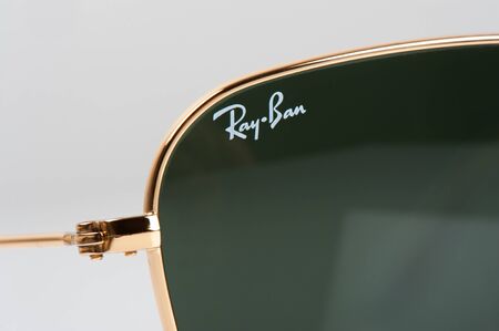 BANGKOK, THAILAND - AUGUST 23, 2016: The Ray-Ban Caravan with gold frame and classic G-15 Lens. Ray-Ban is a brand of sunglasses and eyeglasses founded in 1937 by American company Bausch & Lomb.のeditorial素材