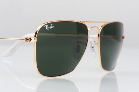 BANGKOK, THAILAND - AUGUST 23, 2016: The Ray-Ban Caravan with gold frame and classic G-15 Lens. Ray-Ban is a brand of sunglasses and eyeglasses founded in 1937 by American company Bausch & Lomb.のeditorial素材