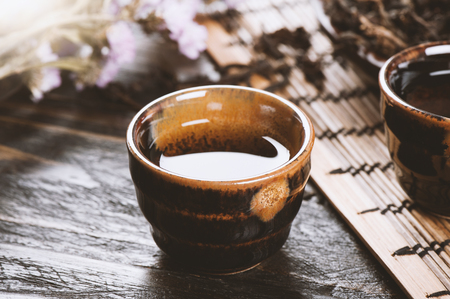 the classic brown japanese tea set on wooden tableの写真素材