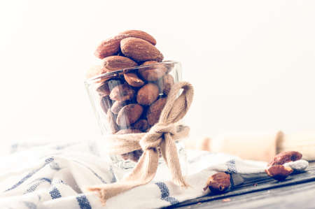 closeup heap of roasted salted almonds, peeled almonds