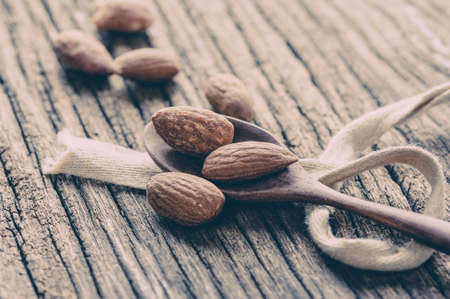 closeup heap of roasted salted almonds, peeled almondsの写真素材