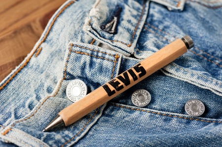 BANGKOK, THAILAND - NOVEMBER 01, 2016: An old wooden souvenir pen from LEVI's. LEVI'S is a brand name of Levi Strauss and Co, founded in 1853.のeditorial素材