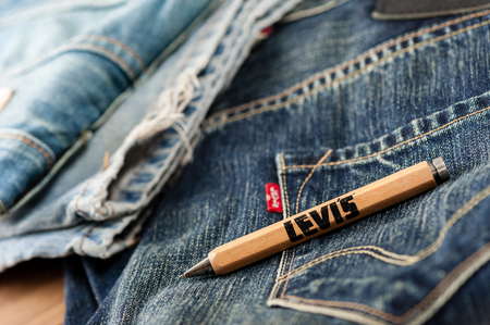 BANGKOK, THAILAND - NOVEMBER 01, 2016: An old wooden souvenir pen from LEVI's. LEVI'S is a brand...