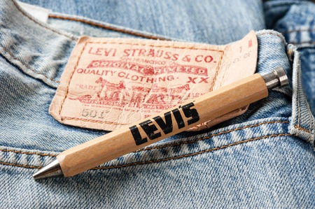BANGKOK, THAILAND - NOVEMBER 01, 2016: An old wooden souvenir pen from LEVI's. LEVI'S is a brand name of Levi Strauss and Co, founded in 1853.のeditorial素材