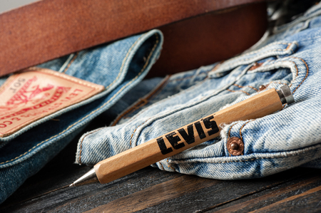 BANGKOK, THAILAND - NOVEMBER 01, 2016: An old wooden souvenir pen from LEVI's. LEVI'S is a brand...
