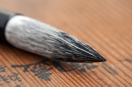 traditional writing brush isolated on wood background, Japanese writing brush, Chinese writing brushの写真素材