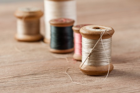 closeup thread for sewing and needlework, old reel of threadの写真素材