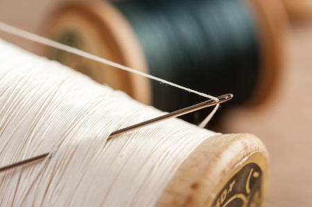 closeup thread for sewing and needlework, old reel of threadの写真素材