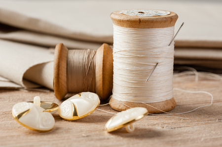 closeup thread for sewing and needlework, old reel of threadの写真素材