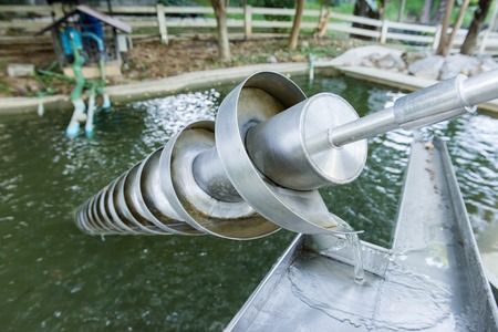 The Archimedes screw, Archimedean screw or screwpump, is a machine historically used for transferring water from a low-lying body of water into irrigation ditches.の写真素材