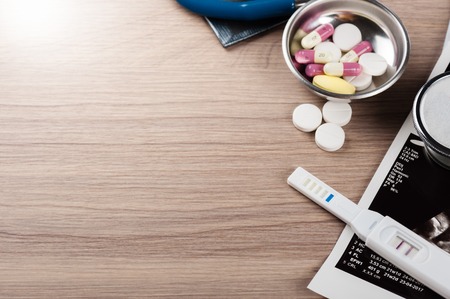 closeup pregnancy test with positive pregnantの写真素材