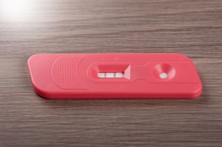 closeup pregnancy test with positive pregnantの写真素材