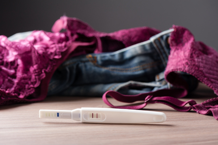 closeup pregnancy test with positive pregnantの写真素材